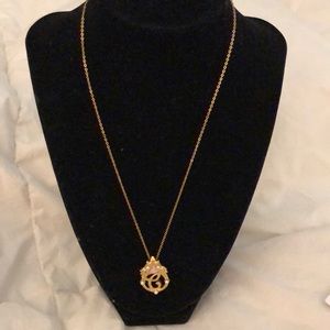 Avon initial delicate goldtone necklace .